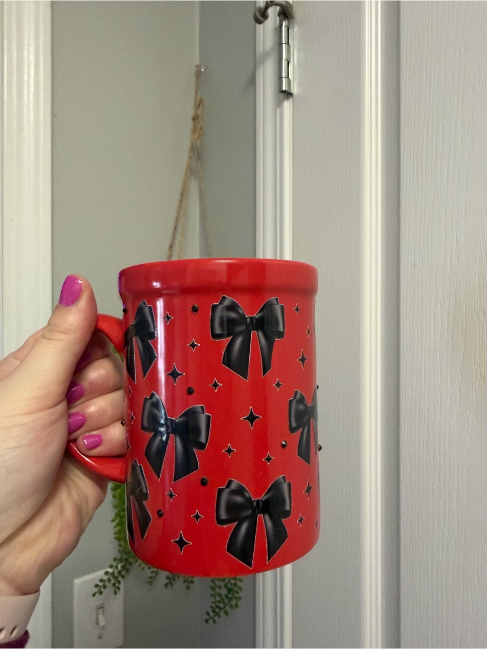 Red Ceramic Mug with Black Bow Pattern